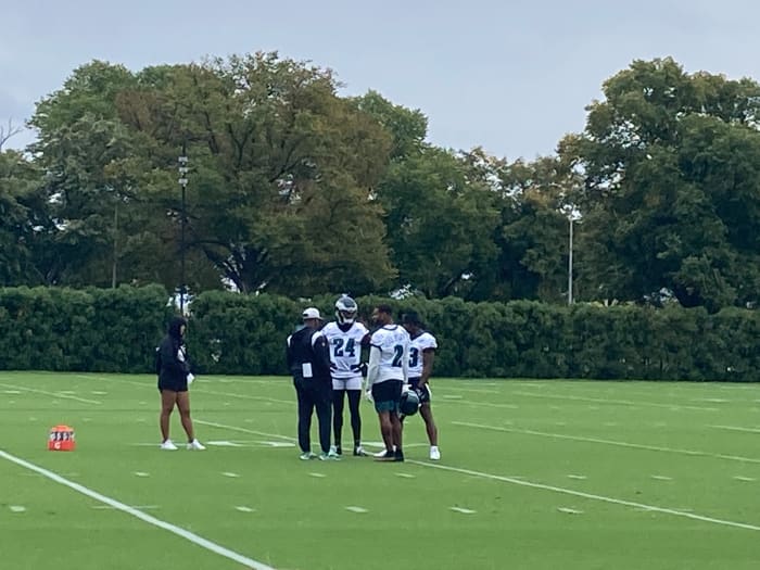 James Bradberry (24), Darius Slay (2), and Chauncey Gardner-Johnson (right) talk with DB coach Dennard Wilson during practice on Sept. 22, 2022